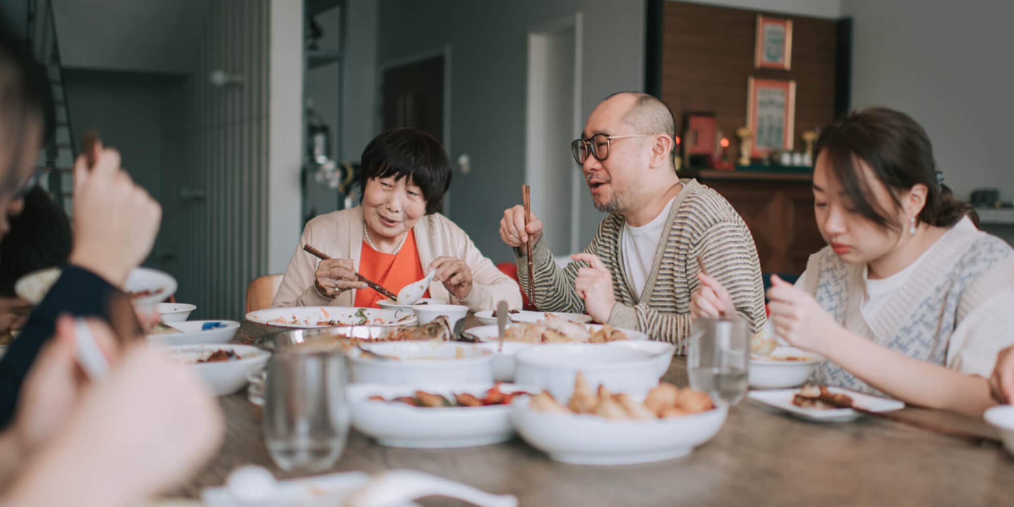 family-sitting-around-dinner-table